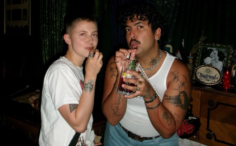 Two friends sharing a drink