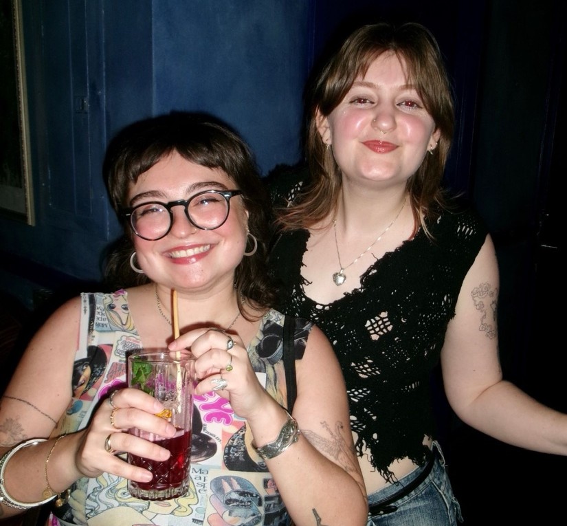 Two friends with drinks