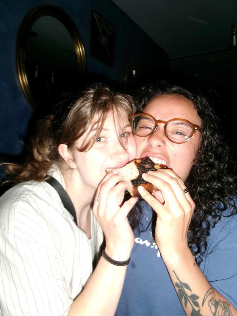 Two friends sharing a bite